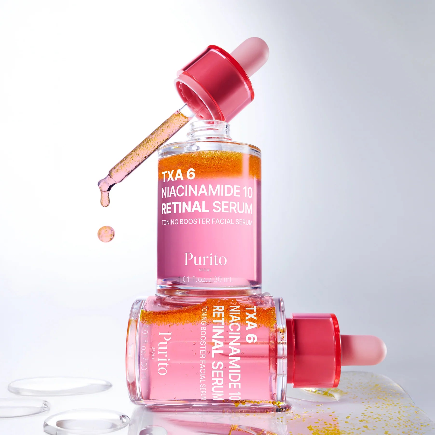 Purito TXA 6 Niacinamide 10% Retinal Serum bottle with dropper on a light gray background
